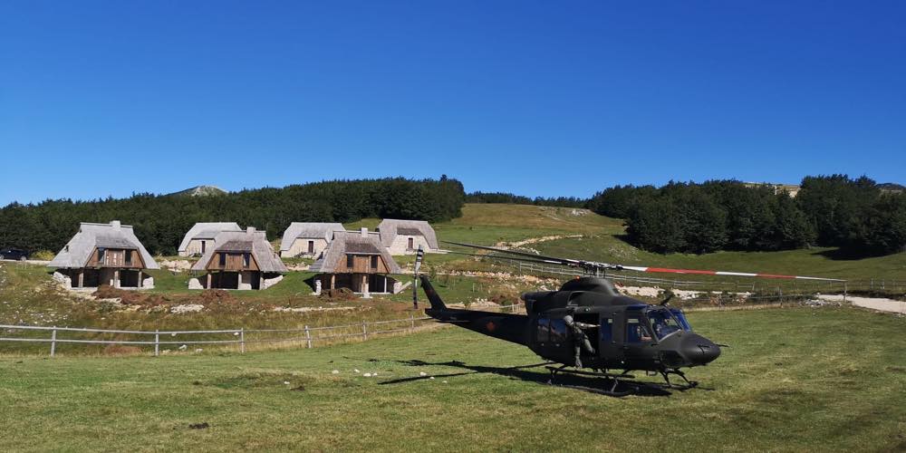 Helicopter landed on the estate meadow before the finished houses